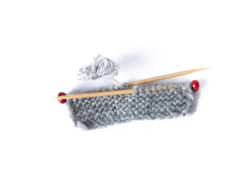 Miniatur Stricknadeln mit Strickzeug